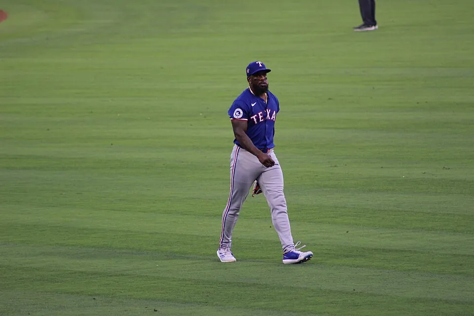 Outfielders Isaac Collins and Adolis Garcia switch teams Image