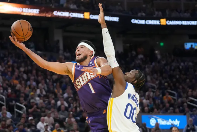 Booker drops 32 to lead Suns over Warriors in season opener